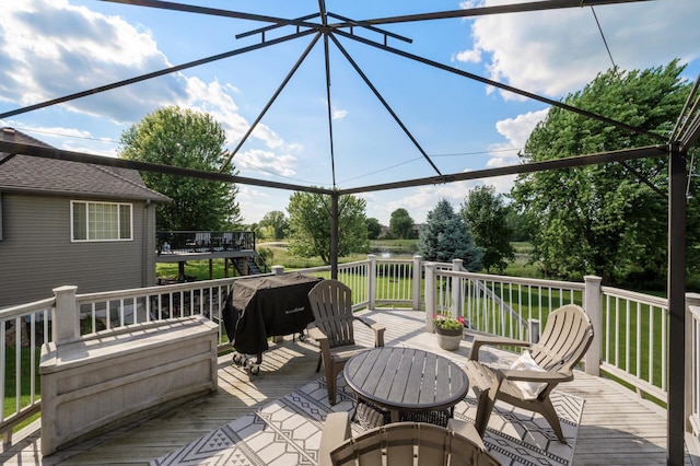 12864 Fondant Trl N, Hugo, MN 55038 - wooden terrace featuring area for grilling and view of scattered trees