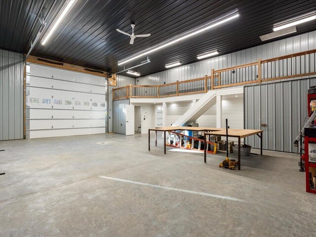 29126 County Road 3, Merrifield, MN 56465 - garage featuring a ceiling fan and metal wall