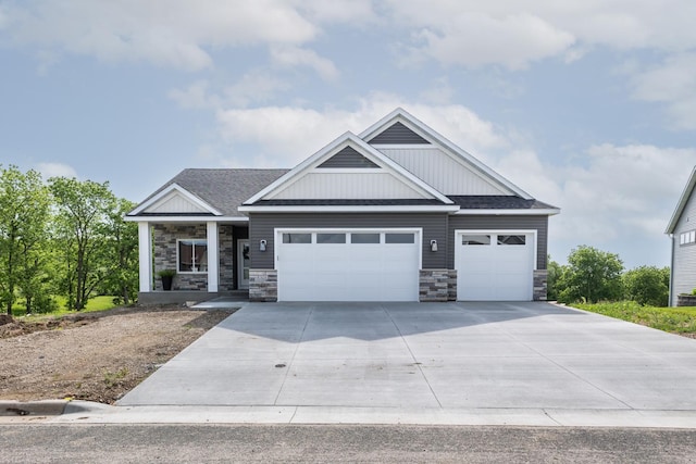 509 Golfview Ave, Zumbrota, MN 55992 - craftsman house with stone siding, an attached garage, driveway, and a shingled roof