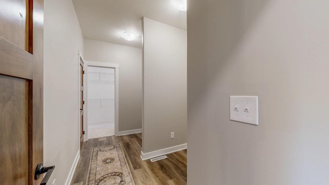 509 Golfview Ave, Zumbrota, MN 55992 - corridor featuring wood finished floors and baseboards