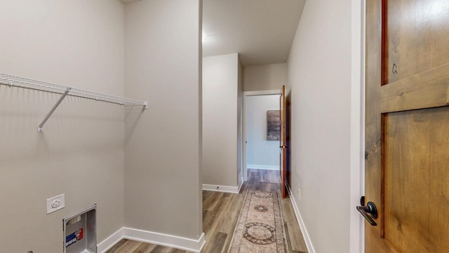 509 Golfview Ave, Zumbrota, MN 55992 - laundry area featuring wood finished floors and electric dryer hookup