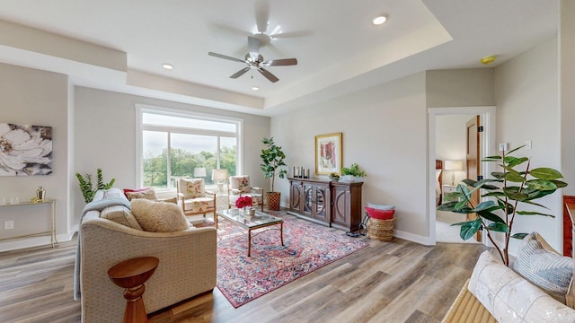509 Golfview Ave, Zumbrota, MN 55992 - living room featuring a raised ceiling, a ceiling fan, wood finished floors, and recessed lighting