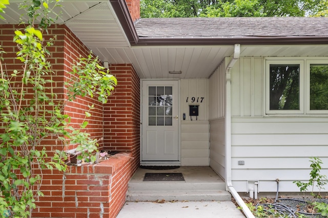 1917 7th St S, Moorhead, MN 56560 - entrance to property featuring brick siding and roof with shingles