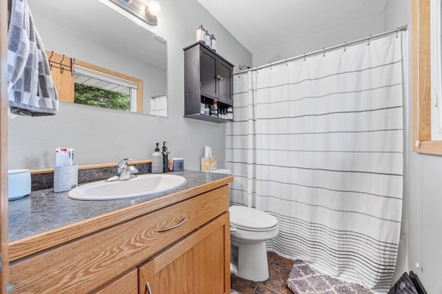 1917 7th St S, Moorhead, MN 56560 - bathroom with vanity, stone finish floors, and a shower with curtain