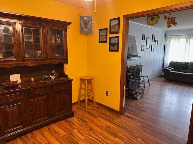 38 Locust Dr, Babbitt, MN 55706 - bar with dark wood-style floors and baseboards