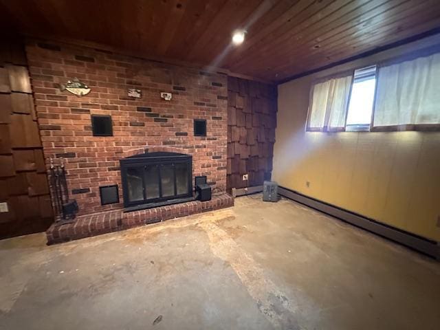38 Locust Dr, Babbitt, MN 55706 - unfurnished living room featuring wooden ceiling, unfinished concrete flooring, a brick fireplace, and a baseboard radiator