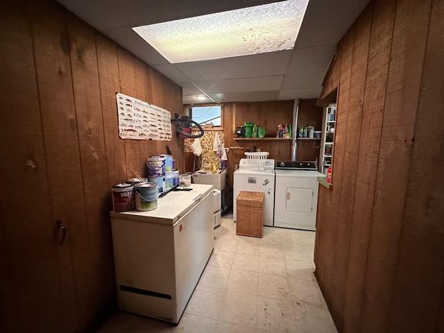 38 Locust Dr, Babbitt, MN 55706 - washroom featuring washer and clothes dryer and wooden walls