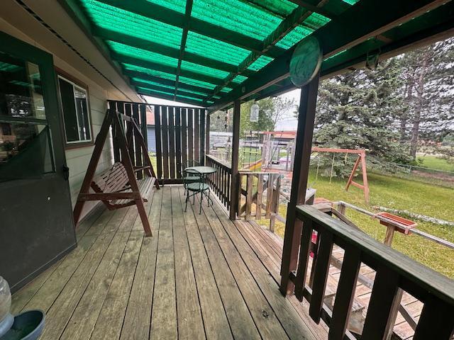 38 Locust Dr, Babbitt, MN 55706 - wooden terrace with a lawn