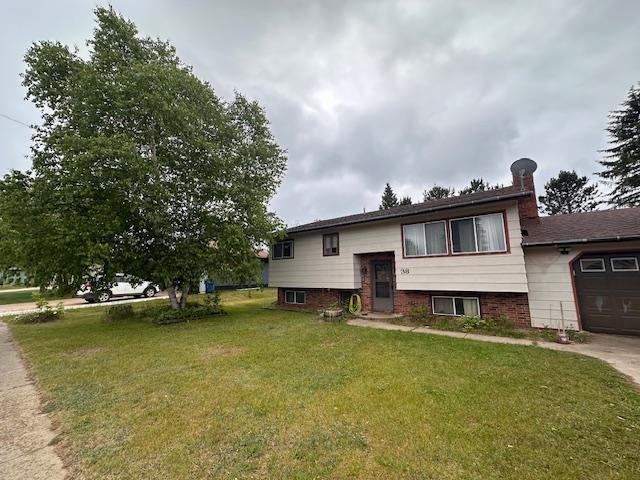 38 Locust Dr, Babbitt, MN 55706 - split foyer home with a front lawn and a garage