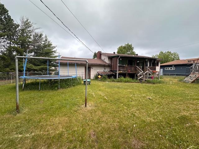 38 Locust Dr, Babbitt, MN 55706 - view of yard with a trampoline and stairs