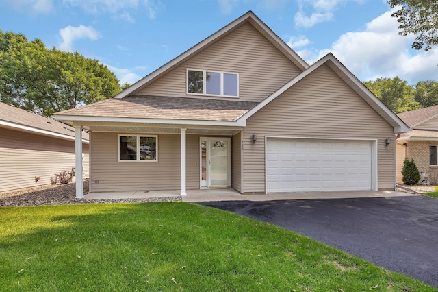 332 Waite Ave S, Saint Cloud, MN 56301 - view of front of property featuring asphalt driveway, covered porch, a front lawn, a shingled roof, and an attached garage