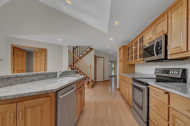 332 Waite Ave S, Saint Cloud, MN 56301 - kitchen with appliances with stainless steel finishes, light brown cabinetry, light stone countertops, recessed lighting, and light wood finished floors