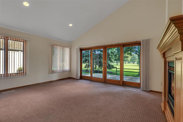 332 Waite Ave S, Saint Cloud, MN 56301 - unfurnished room featuring high vaulted ceiling, carpet floors, plenty of natural light, recessed lighting, and a fireplace