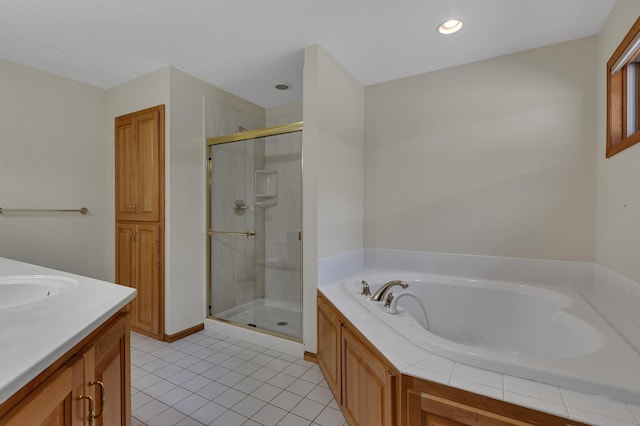 332 Waite Ave S, Saint Cloud, MN 56301 - bathroom featuring a stall shower, a garden tub, tile patterned flooring, vanity, and recessed lighting