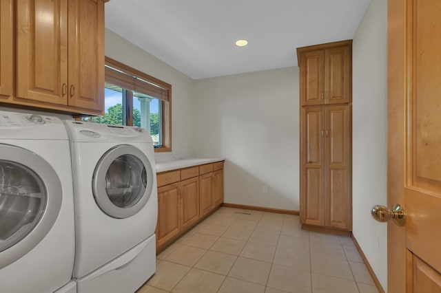 332 Waite Ave S, Saint Cloud, MN 56301 - laundry room featuring washing machine and dryer, cabinet space, recessed lighting, and light tile patterned flooring