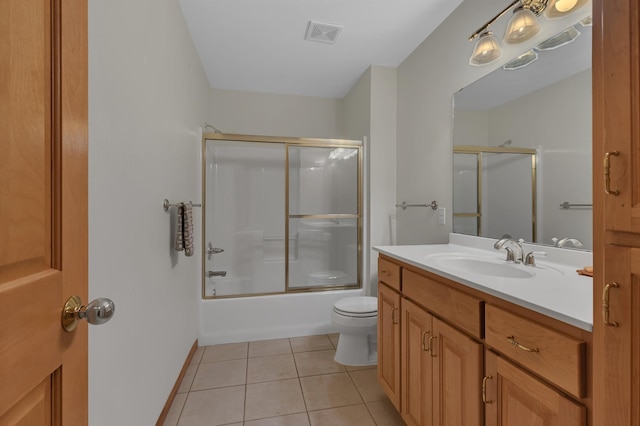332 Waite Ave S, Saint Cloud, MN 56301 - full bathroom featuring vanity, tile patterned floors, and combined bath / shower with glass door