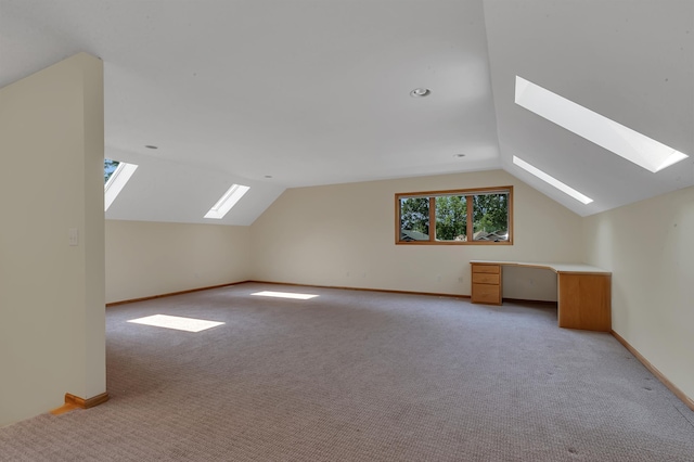 332 Waite Ave S, Saint Cloud, MN 56301 - bonus room featuring a skylight, vaulted ceiling, and light carpet