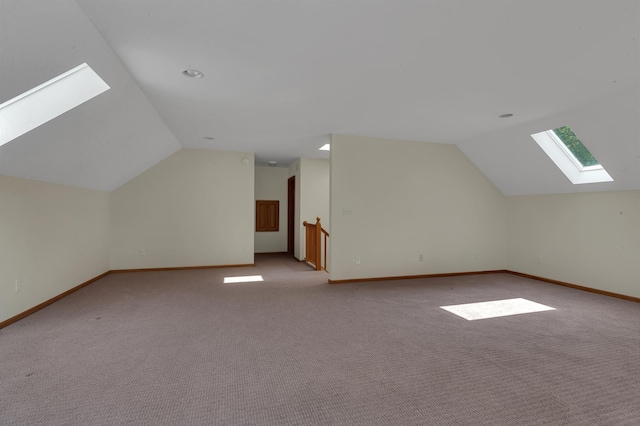 332 Waite Ave S, Saint Cloud, MN 56301 - bonus room with a skylight, lofted ceiling, and light colored carpet