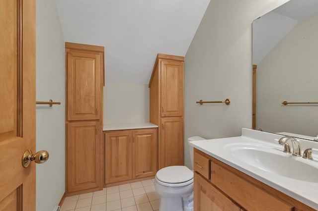 332 Waite Ave S, Saint Cloud, MN 56301 - bathroom with vaulted ceiling, vanity, and tile patterned flooring