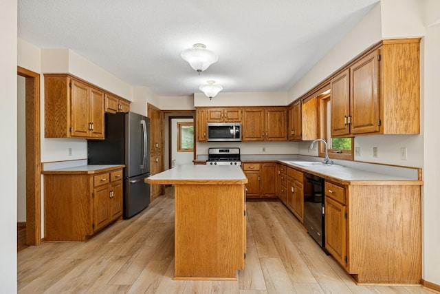 6233 Fernbrook Ln N, Maple Grove, MN 55311 - kitchen featuring appliances with stainless steel finishes, light countertops, light wood-type flooring, brown cabinets, and a center island