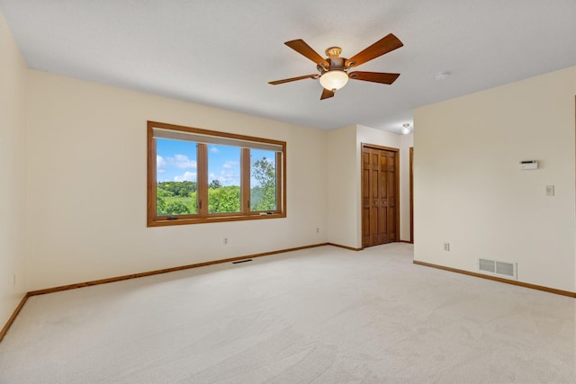 6233 Fernbrook Ln N, Maple Grove, MN 55311 - spare room featuring light colored carpet, ceiling fan, and a smoke detector