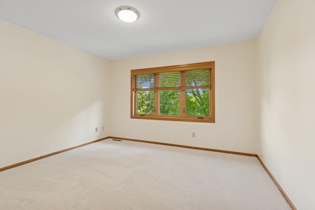 6233 Fernbrook Ln N, Maple Grove, MN 55311 - unfurnished room featuring light colored carpet and baseboards