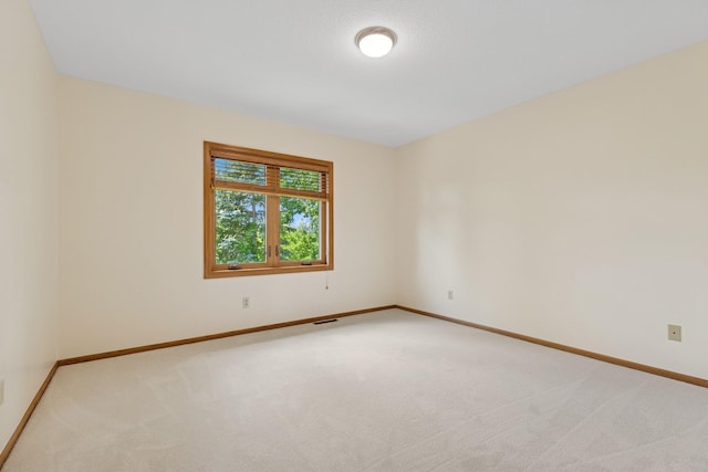 6233 Fernbrook Ln N, Maple Grove, MN 55311 - unfurnished room featuring light colored carpet and baseboards