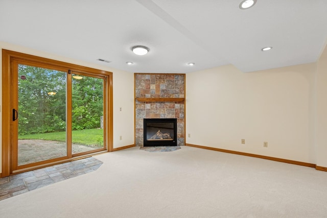 6233 Fernbrook Ln N, Maple Grove, MN 55311 - unfurnished living room featuring carpet, a tiled fireplace, and recessed lighting