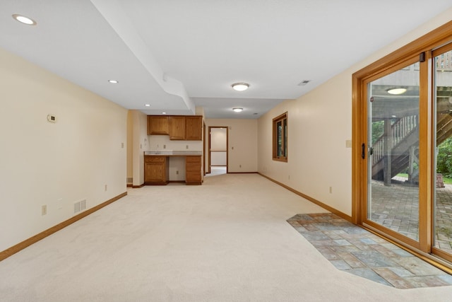 6233 Fernbrook Ln N, Maple Grove, MN 55311 - unfurnished living room with healthy amount of natural light, light colored carpet, and recessed lighting
