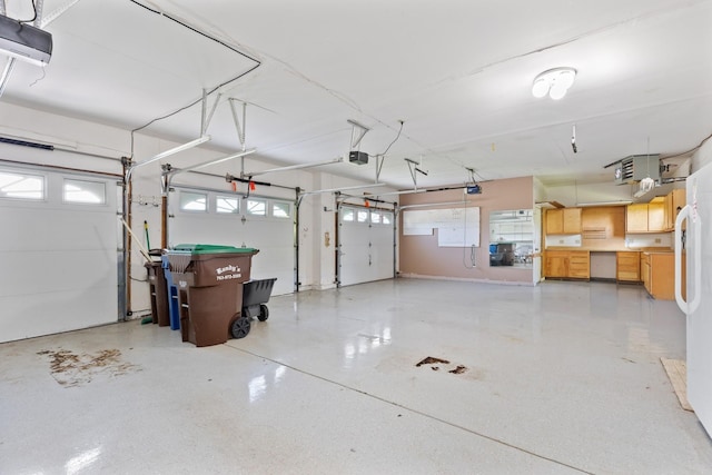 6233 Fernbrook Ln N, Maple Grove, MN 55311 - garage featuring freestanding refrigerator and a garage door opener