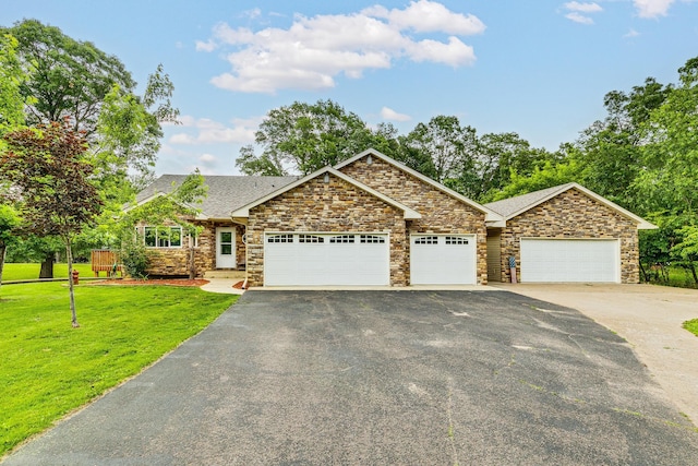 3220 Vine St, Cambridge, MN 55008 - craftsman inspired home featuring asphalt driveway, an attached garage, a front yard, and stone siding