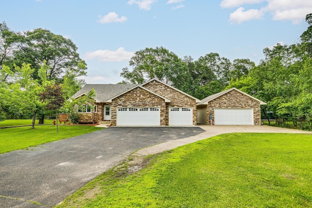 3220 Vine St, Cambridge, MN 55008 - view of front of house with driveway, an attached garage, stone siding, and a front yard