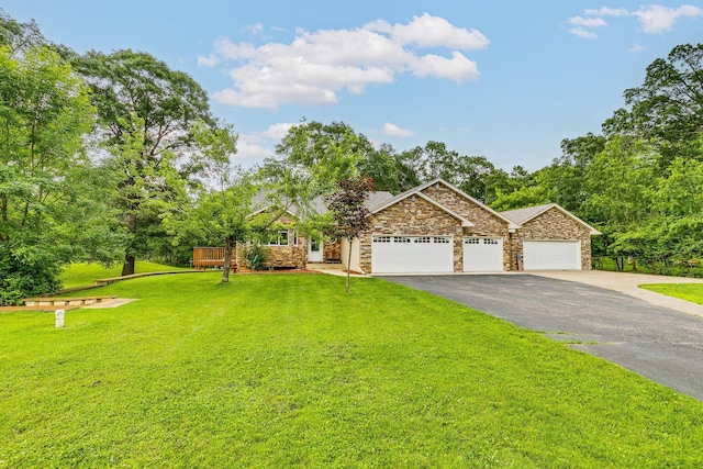3220 Vine St, Cambridge, MN 55008 - view of front of home with asphalt driveway, an attached garage, a front lawn, and stone siding