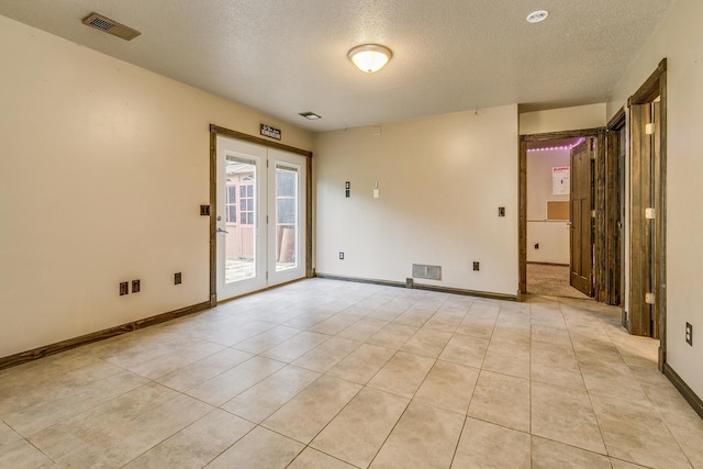 3220 Vine St, Cambridge, MN 55008 - unfurnished room with a textured ceiling and light tile patterned floors