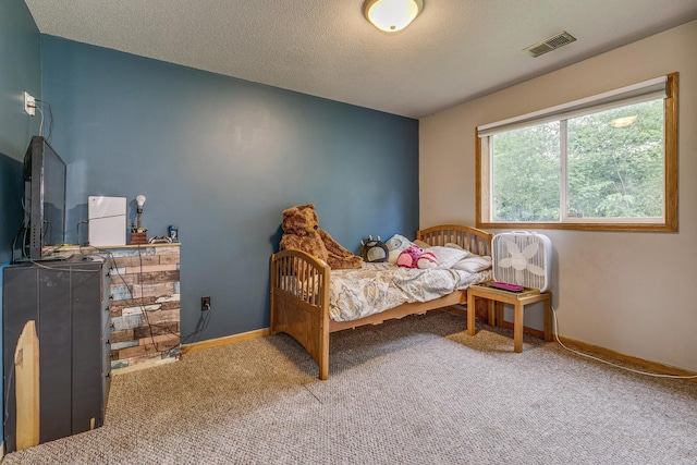 3220 Vine St, Cambridge, MN 55008 - carpeted bedroom with baseboards and a textured ceiling