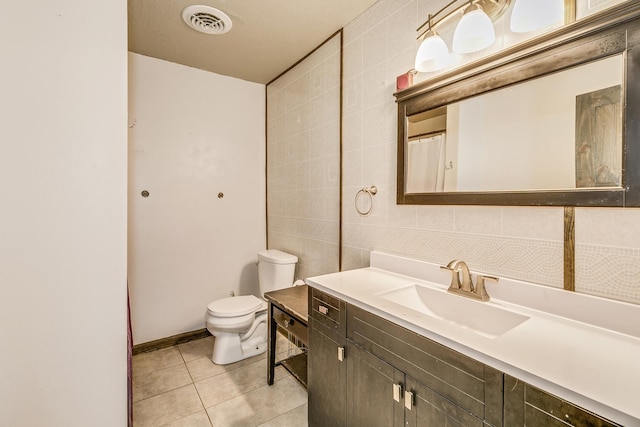 3220 Vine St, Cambridge, MN 55008 - bathroom with vanity, tile patterned flooring, and tile walls