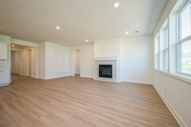 14526 111th Ave E, Dayton, MN 55369 - unfurnished living room featuring light wood-type flooring, recessed lighting, a fireplace, and baseboards