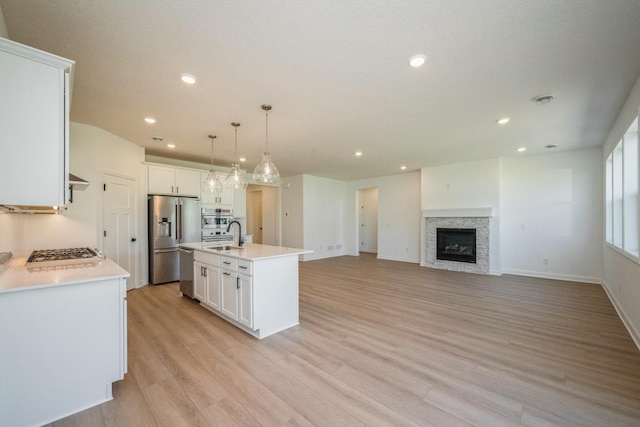 14526 111th Ave E, Dayton, MN 55369 - kitchen featuring appliances with stainless steel finishes, a sink, recessed lighting, white cabinetry, and light wood-type flooring
