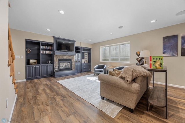 215 51st Ave E, West Fargo, ND 58078 - living area with a multi sided fireplace, dark wood-style floors, and recessed lighting