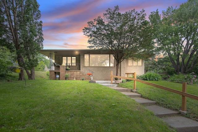 895 Humboldt Ave W, Saint Paul, MN 55118 - view of front of property featuring a front yard, stairway, and stucco siding