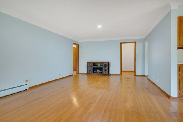 895 Humboldt Ave W, Saint Paul, MN 55118 - unfurnished living room with a lit fireplace, light wood-style flooring, a baseboard radiator, and recessed lighting