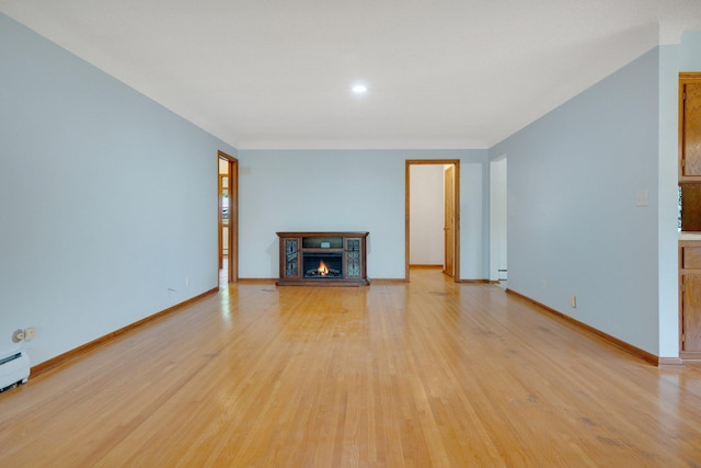 895 Humboldt Ave W, Saint Paul, MN 55118 - unfurnished living room with a warm lit fireplace, light wood-style flooring, and recessed lighting