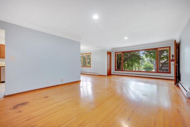 895 Humboldt Ave W, Saint Paul, MN 55118 - unfurnished living room featuring baseboard heating, light wood-style floors, and recessed lighting