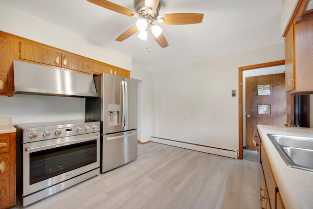 895 Humboldt Ave W, Saint Paul, MN 55118 - kitchen featuring under cabinet range hood, stainless steel appliances, a baseboard heating unit, ceiling fan, and light countertops