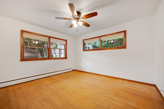 895 Humboldt Ave W, Saint Paul, MN 55118 - unfurnished room with healthy amount of natural light, a baseboard radiator, ceiling fan, and wood finished floors