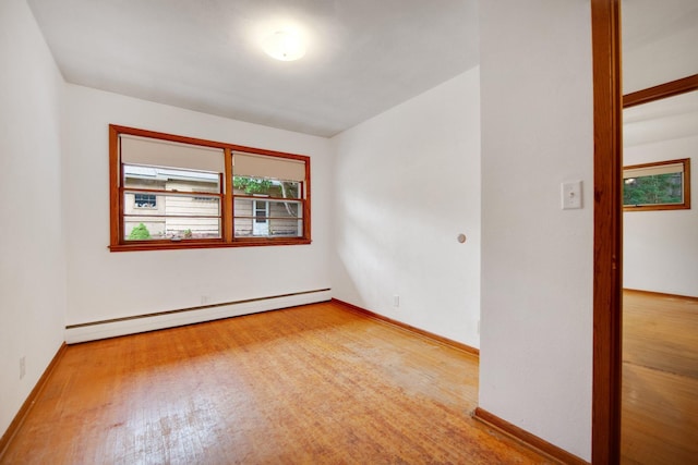 895 Humboldt Ave W, Saint Paul, MN 55118 - spare room featuring a baseboard radiator and wood finished floors
