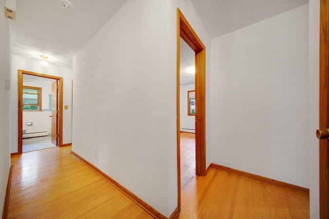 895 Humboldt Ave W, Saint Paul, MN 55118 - corridor featuring a baseboard heating unit and light wood finished floors