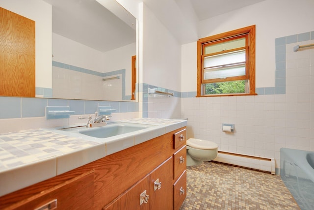 895 Humboldt Ave W, Saint Paul, MN 55118 - bathroom featuring a baseboard radiator, tile walls, vanity, and a wainscoted wall