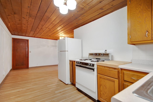 895 Humboldt Ave W, Saint Paul, MN 55118 - kitchen featuring white appliances, light countertops, light wood finished floors, wood ceiling, and decorative backsplash
