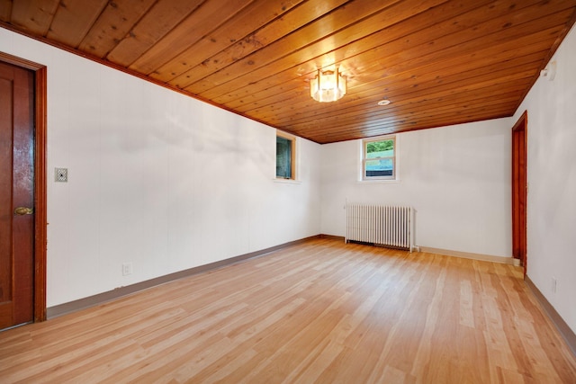 895 Humboldt Ave W, Saint Paul, MN 55118 - spare room featuring radiator, wood ceiling, and light wood-style floors